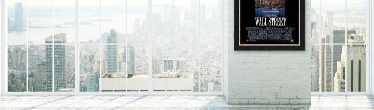 A photo of a One Sheet Movie Poster for Wall Street against a Manhattan skyline.