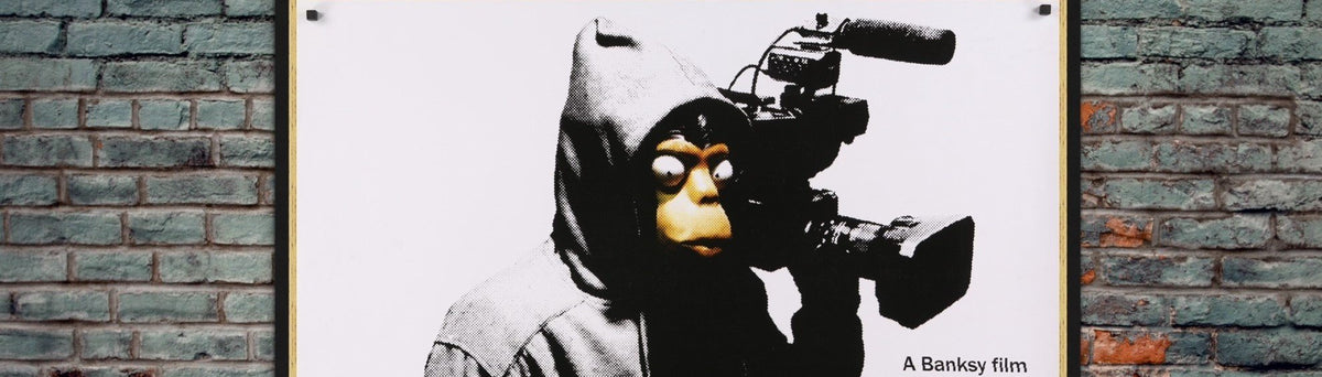 A close up of an original movie poster for the Banksy film Exit Through the Gift Shop