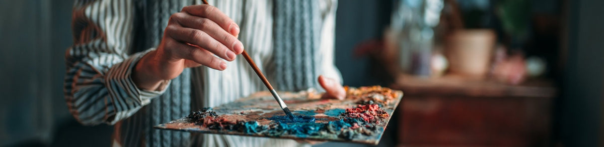 Artist hand, brush with pallette
