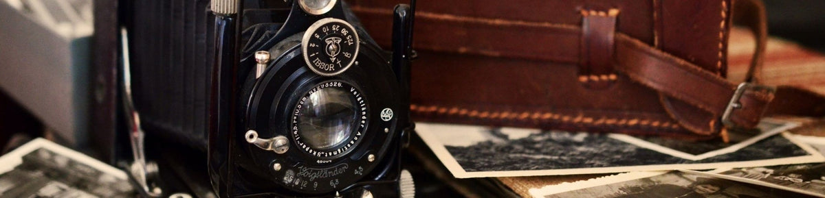 A photo of an old camera and some old photos
