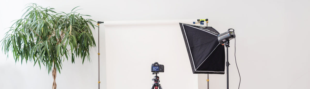 A photo of a camera and light box set up for filming