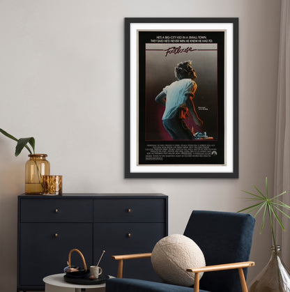 An original movie poster for the Kevin Bacon film Footloose