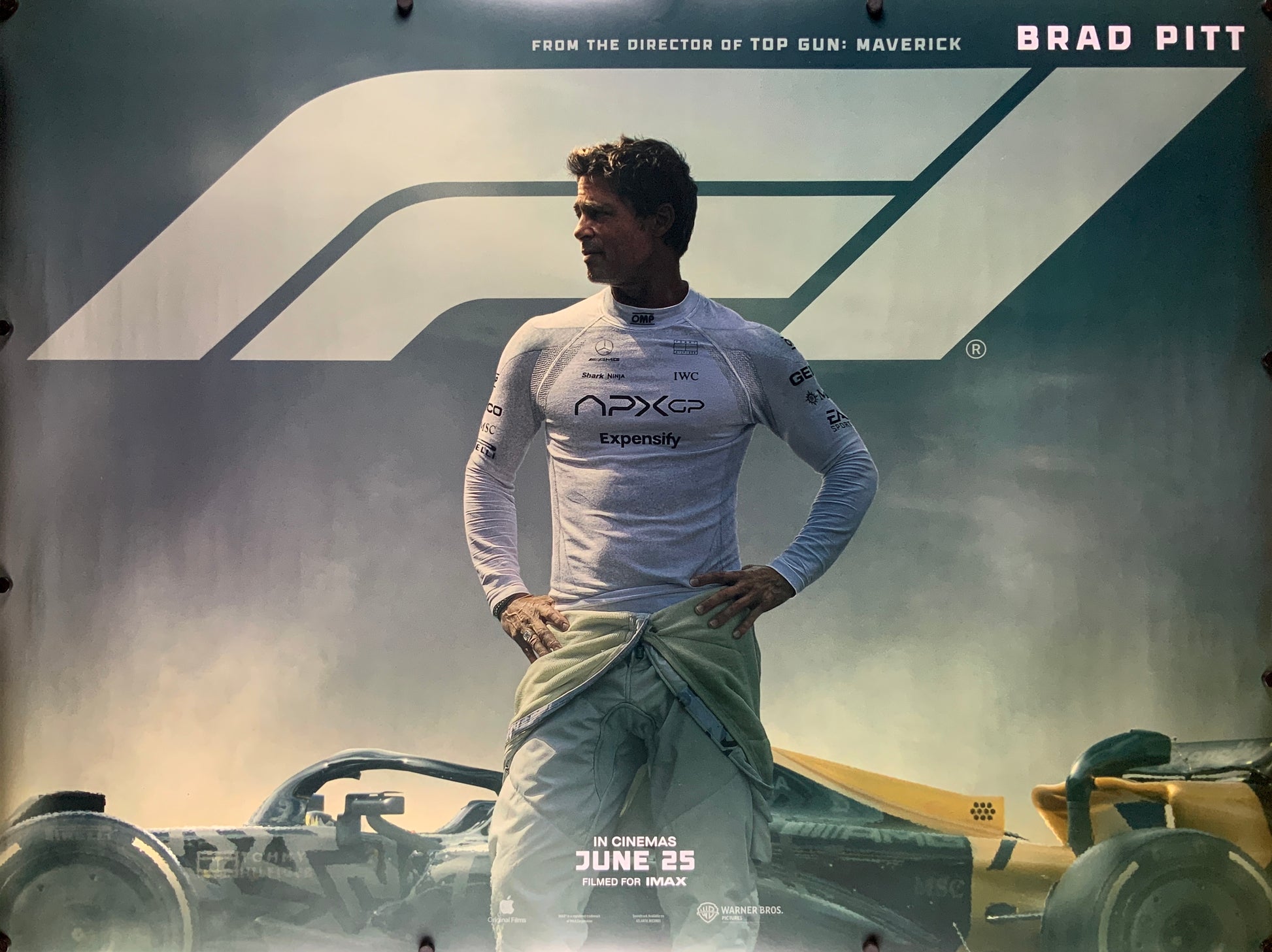 An original movie poster for the Brad Pitt film F1 The Movie