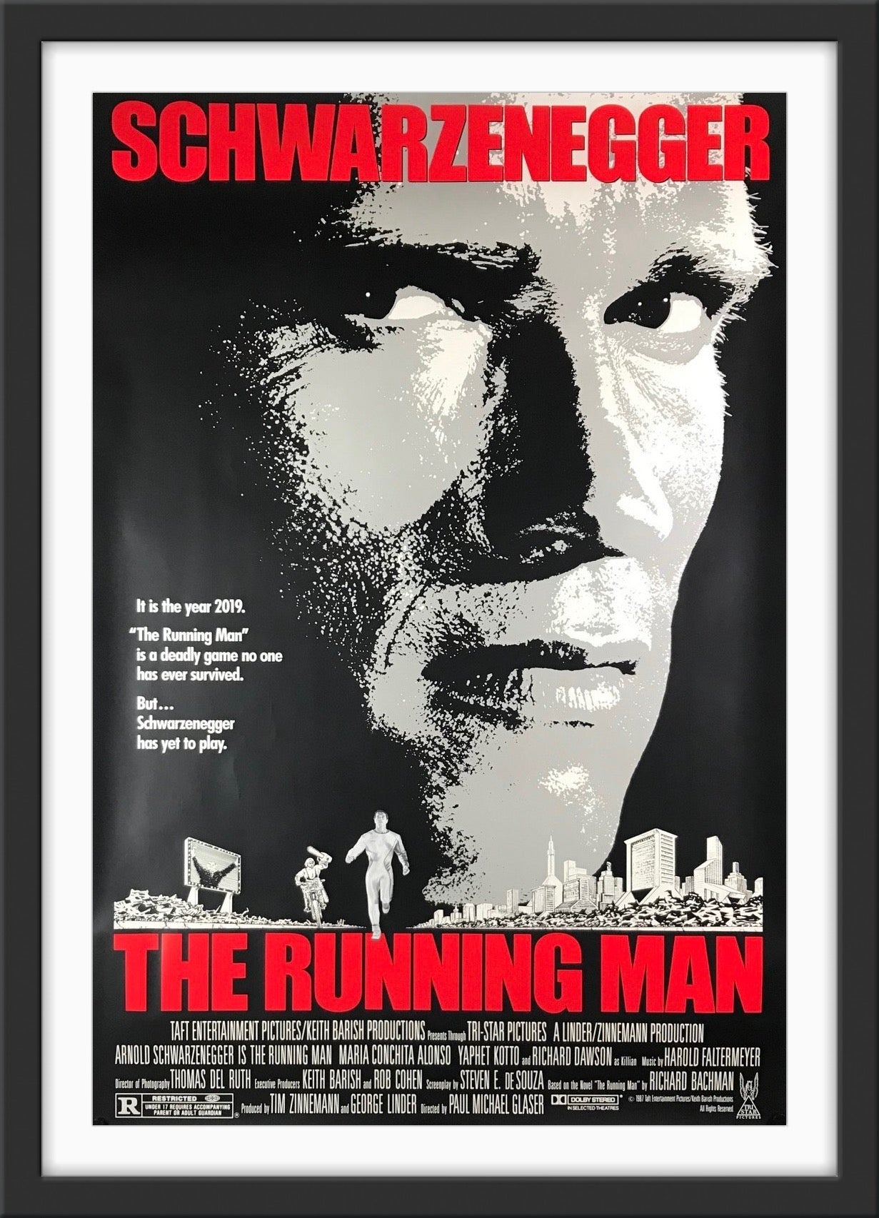 An original movie poster for the film The Running Man