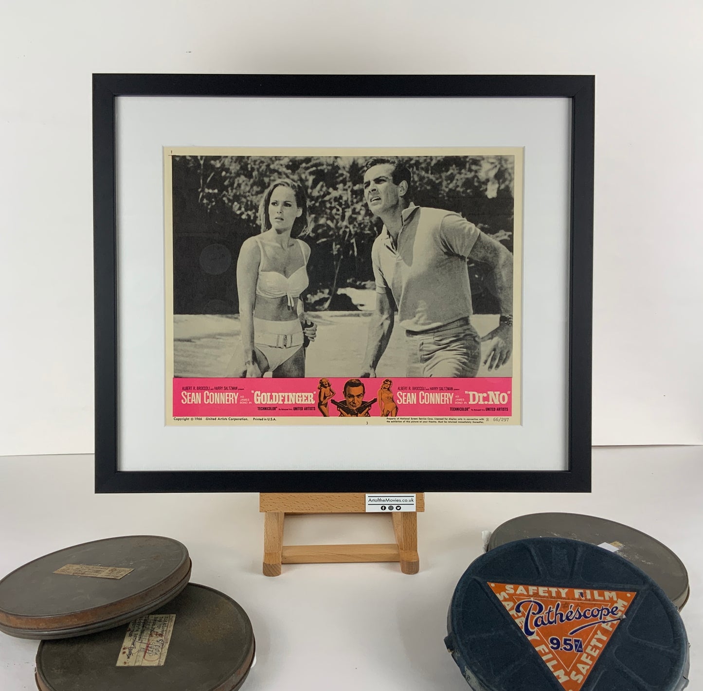 An original 11x14 lobby card for the James Bond double-bill Dr No and Goldfinger