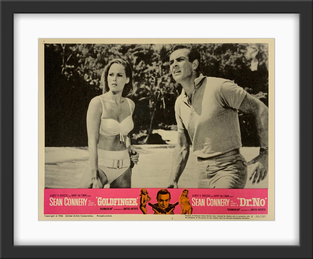 An original 11x14 lobby card for the James Bond double-bill Dr No and Goldfinger