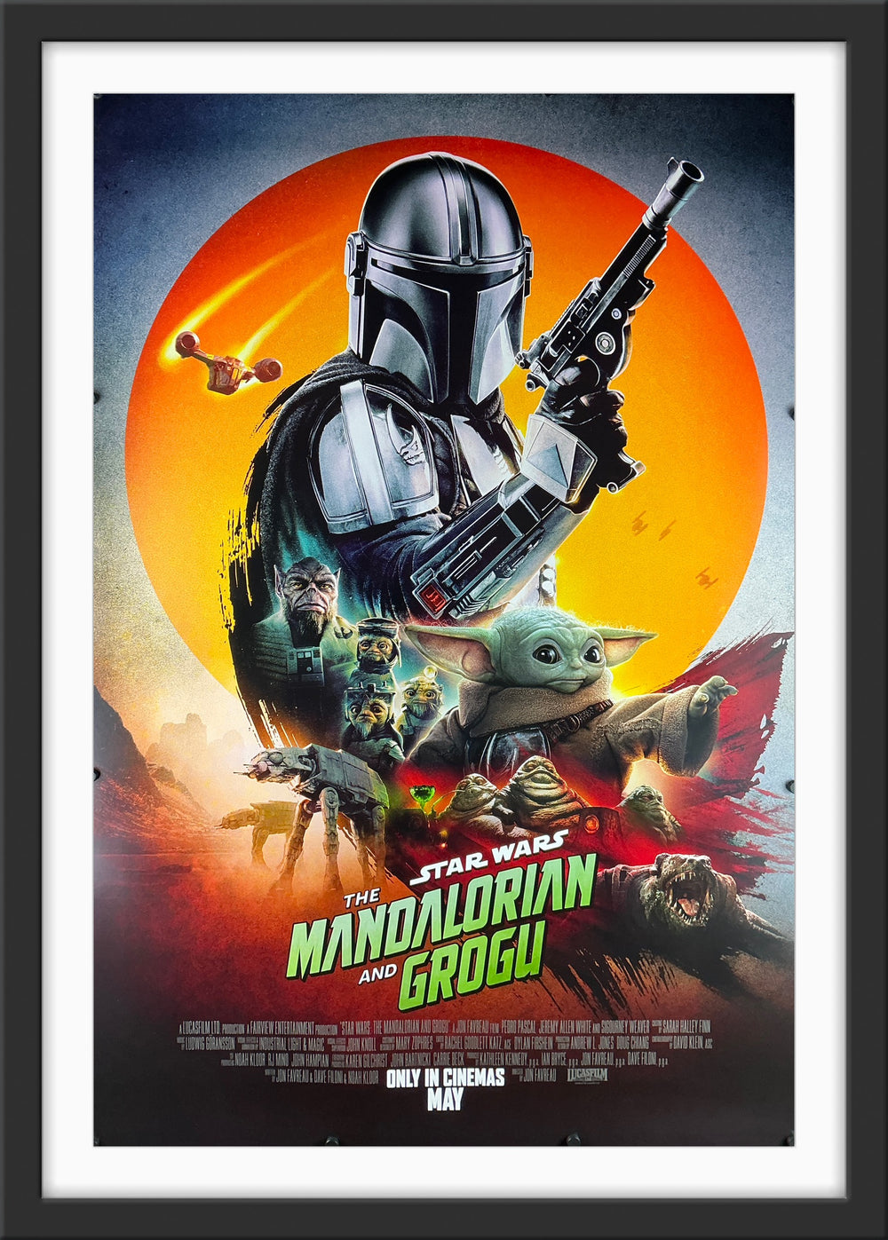 An original movie poster for the Star Wars film The Mandalorian and Grogu