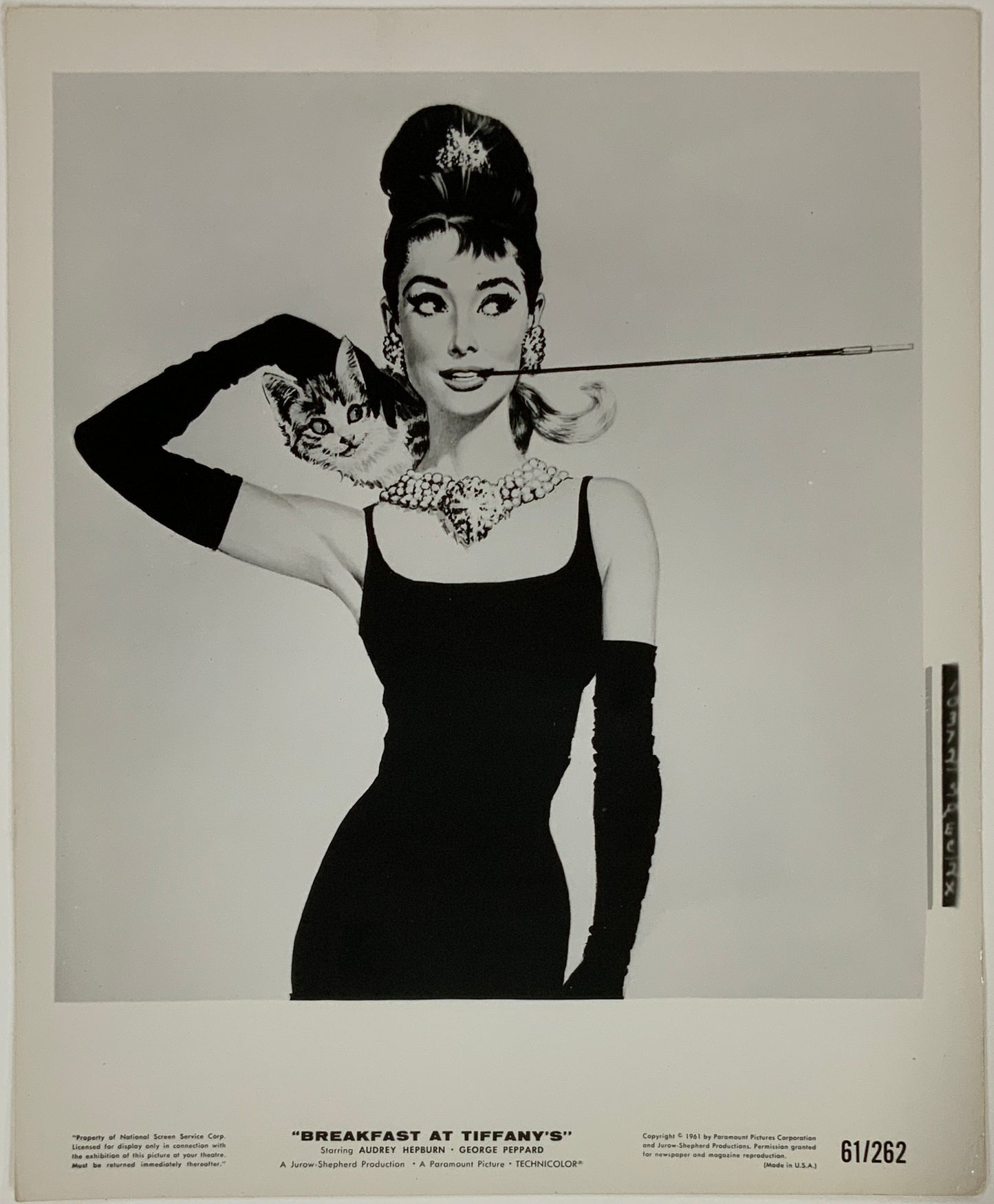 An original movie still for the film Breakfast At Tiffany's with artwork by Robert McGinnis