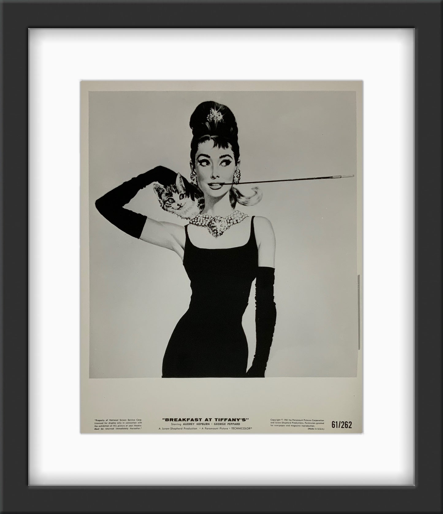 An original movie still for the film Breakfast At Tiffany's with artwork by Robert McGinnis