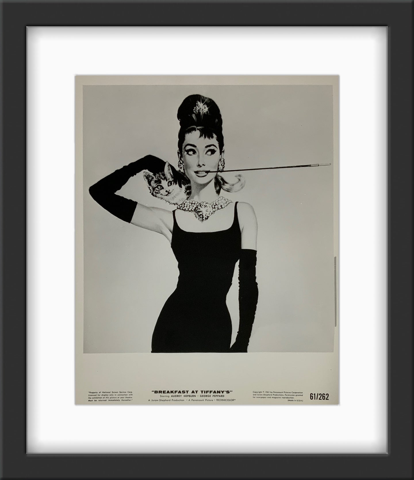 An original movie still for the film Breakfast At Tiffany's with artwork by Robert McGinnis