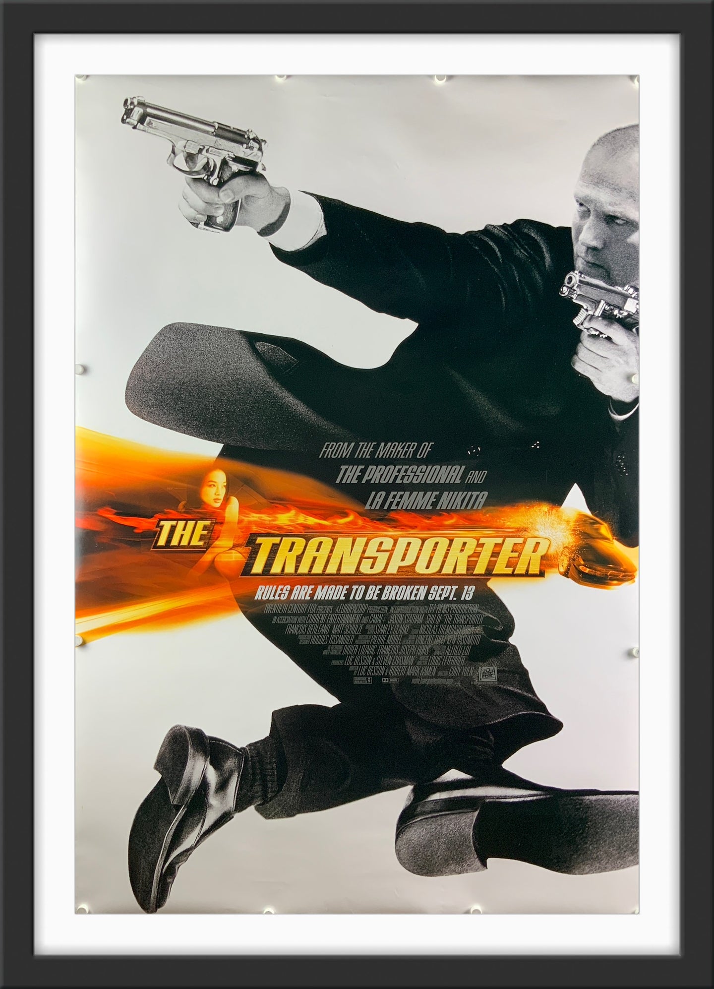 An original movie poster for the Jason Statham film The Transporter