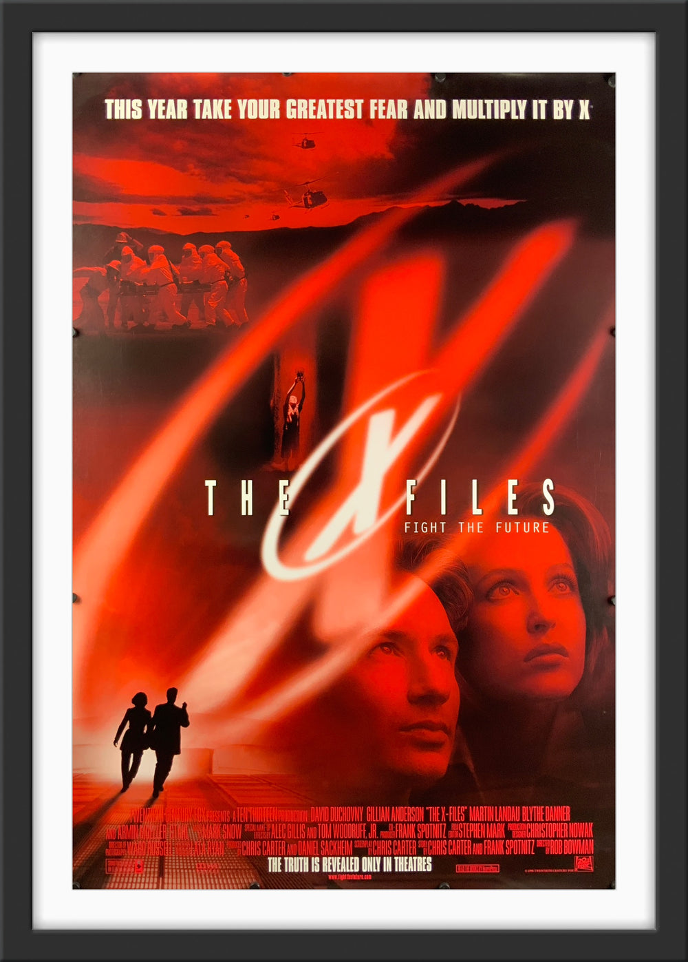 An original movie poster for the film The X Files Fight The Future