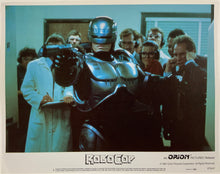 Load image into Gallery viewer, An original and framed 11x14 lobby card for the film Robocop