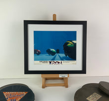 Load image into Gallery viewer, An original and framed lobby card for the Disney film Tron