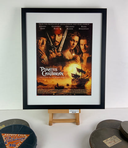 An original title lobby card for the film Pirates of the Caribbean: The Curse of the Black Pearl