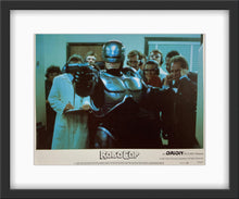 Load image into Gallery viewer, An original and framed 11x14 lobby card for the film Robocop