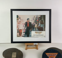 Load image into Gallery viewer, An original 11x14 lobby card for the film Saturday Night Fever