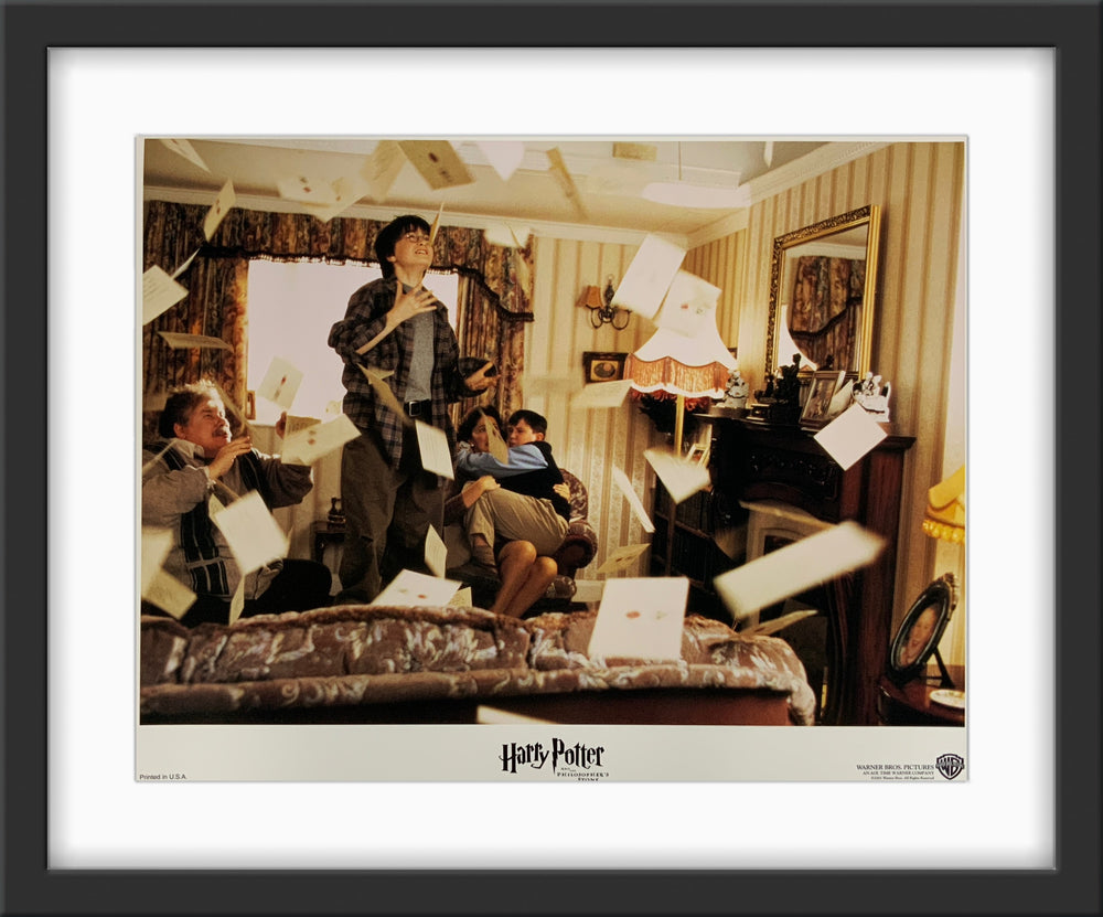 An original 11x14 lobby card for the Wiazrding World film Harry Potter and the Philosopher's Stone