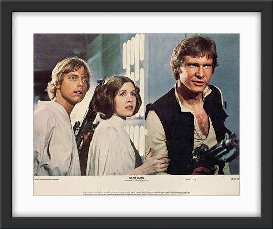 An original 11x14 lobby card for the George Lucas film Star Wars (1977)
