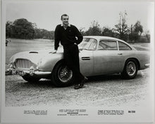 Load image into Gallery viewer, An original movie still from the James Bond film Goldfinger