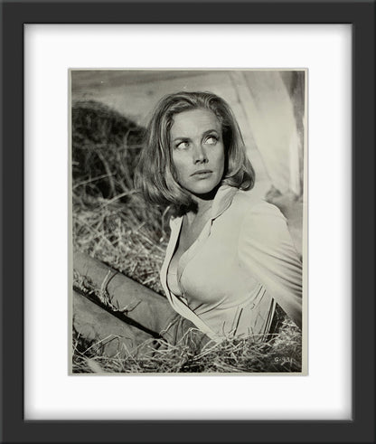 An original 8x10 movie still of Honor Blackman as Pussy Galore in the James Bond film Goldfinger