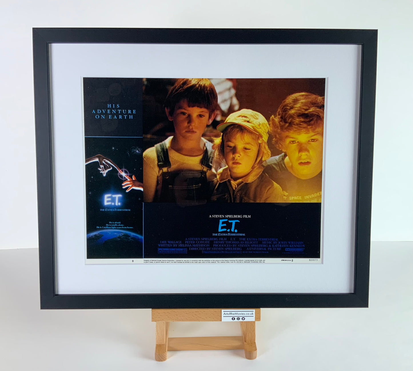 An original 11x14 lobby card for the Stephen Spielberg film E.T. The Extra Terrestrial