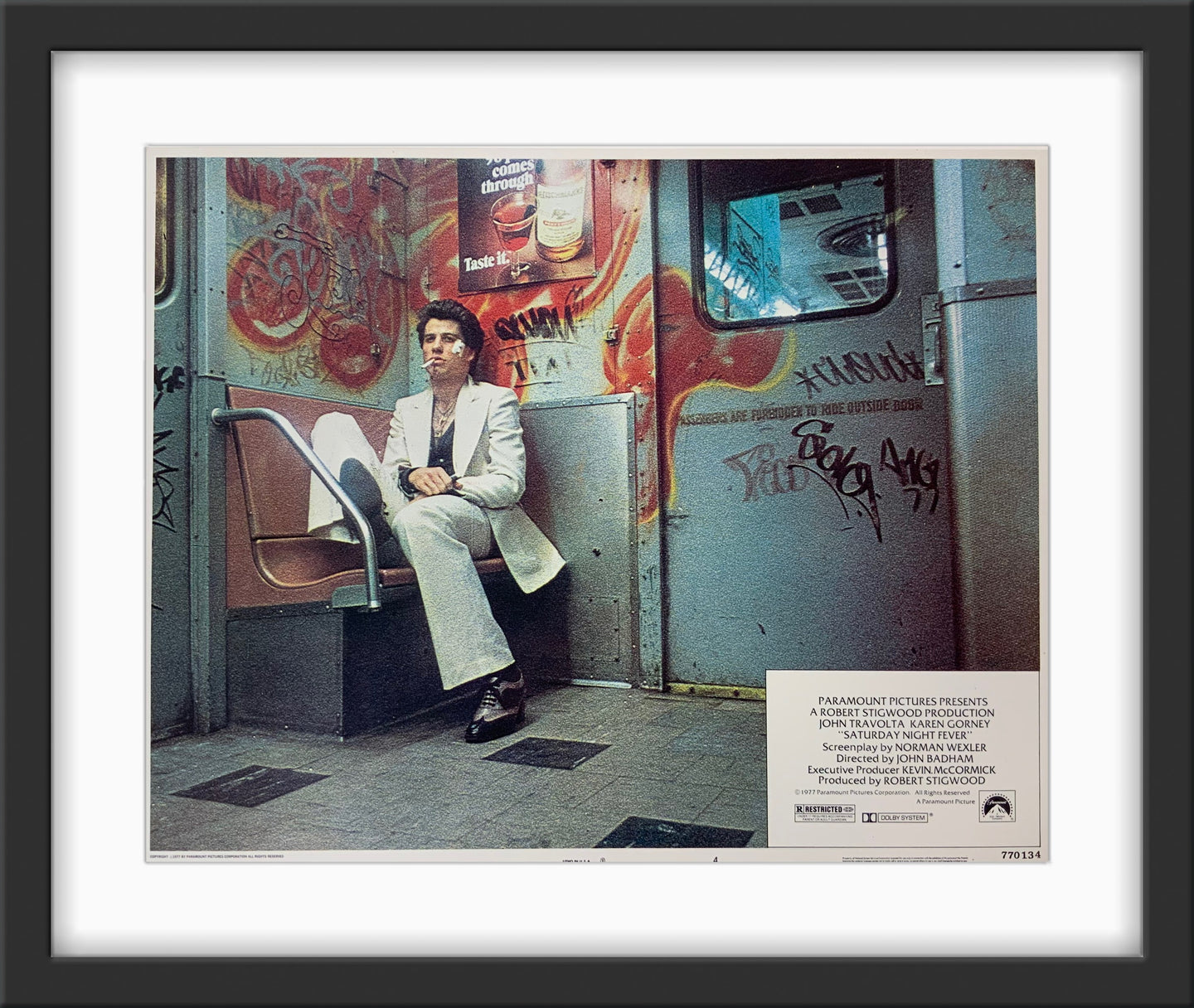An original 11x14 lobby card for the film Saturday Night Fever