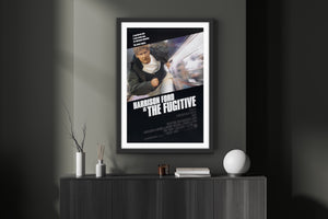An original movie poster for the Harrison Ford film The Fugitive