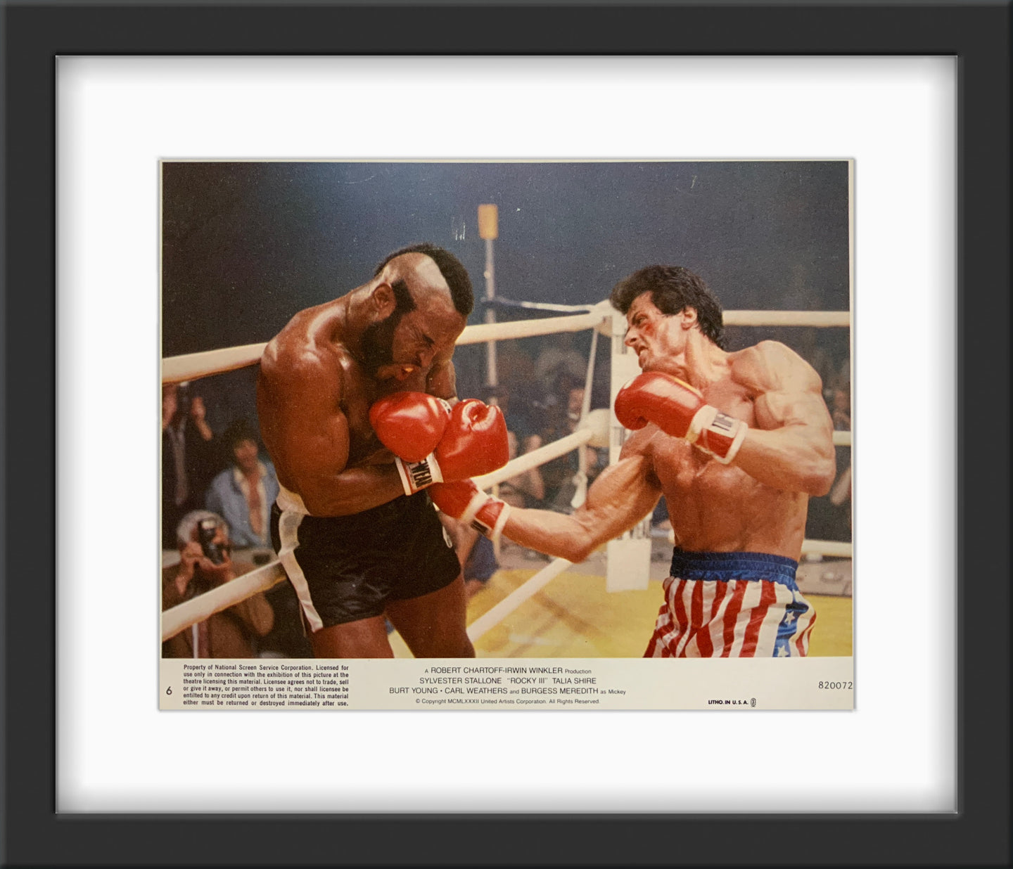 An original lobby card for the film Rocky III