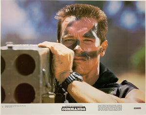 An original 11x14 lobby card for the Arnold Schwarzenegger film Commando