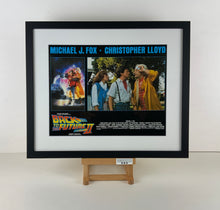 Load image into Gallery viewer, An original 11x14 lobby card for the film Back to the Future 2 / II