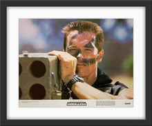 Load image into Gallery viewer, An original 11x14 lobby card for the Arnold Schwarzenegger film Commando