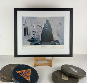 An original and framed 11x14 lobby card for the film Star Wars / Episode 4 / IV / A New Hope