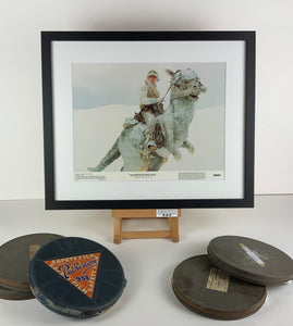 An original and framed 11x14 lobby card for the Star Wars film The Empire Strikes Back