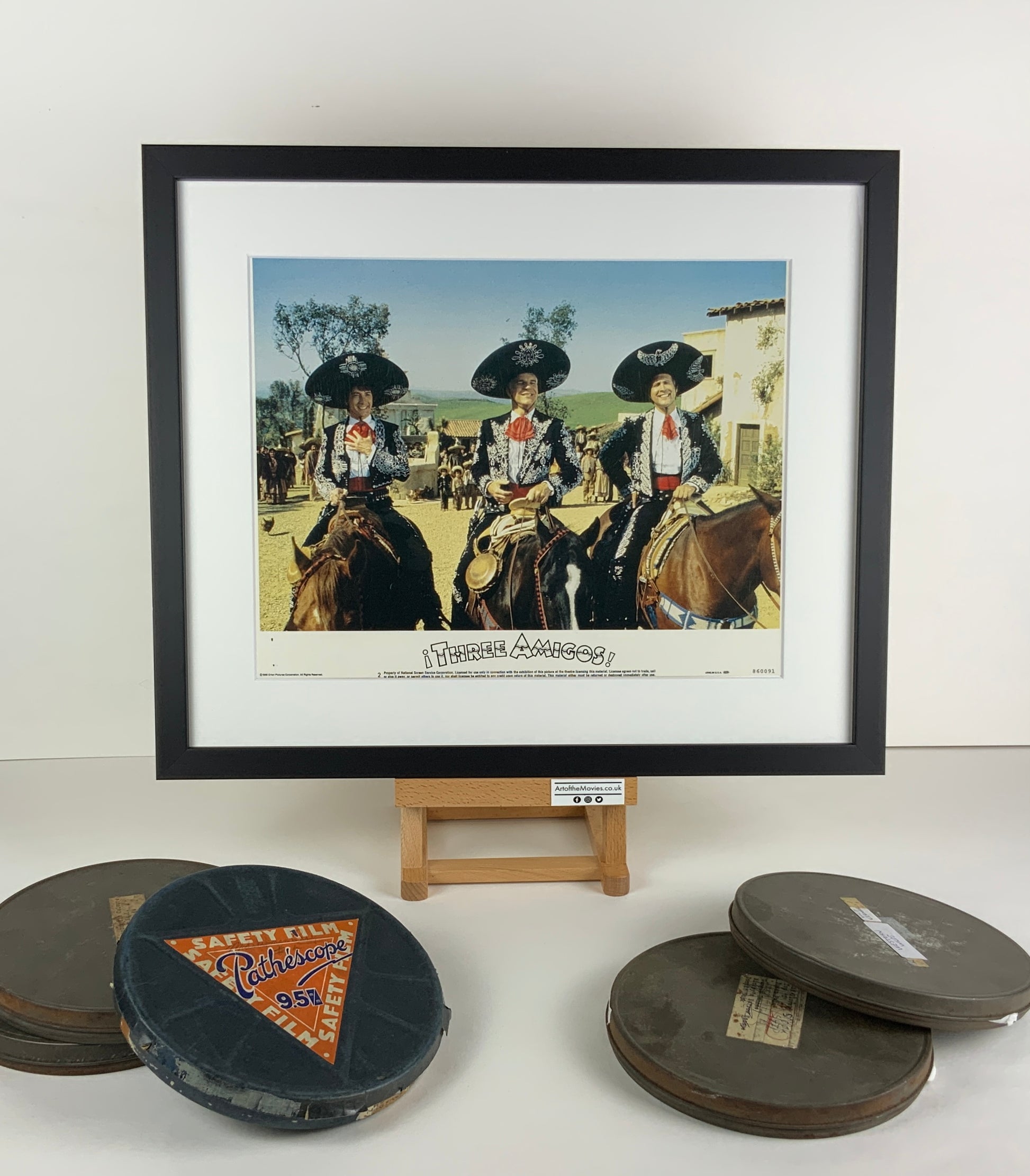 An original framed lobby card for the film Three Amigos