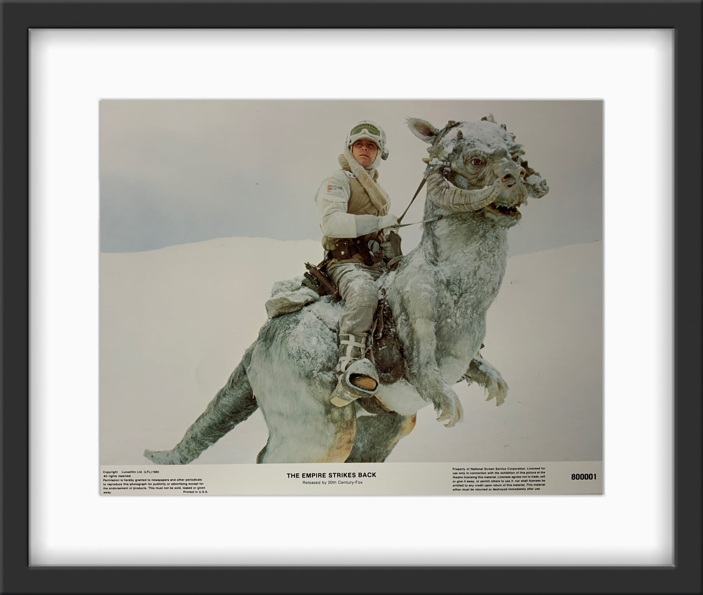 An original and framed 11x14 lobby card for the Star Wars film The Empire Strikes Back