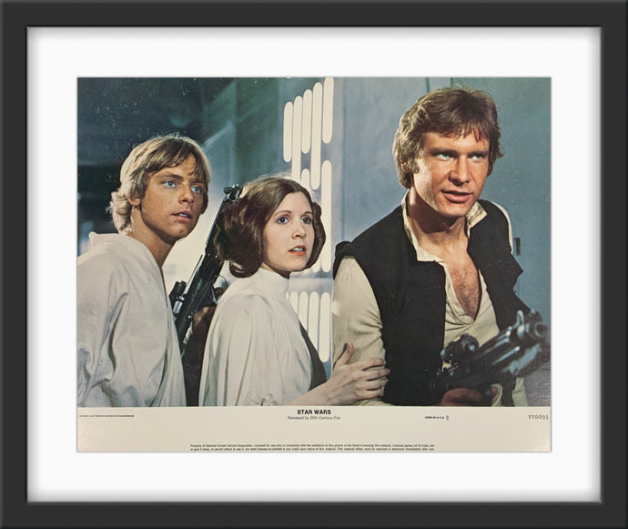 An original 11x14 lobby card for the George Lucas film Star Wars