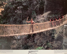 Load image into Gallery viewer, An original 11x14 lobby card for the film Indiana Jones and the Temple of Doom