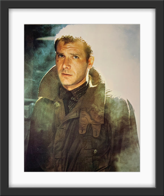 An original 11x14 lobby card for the Ridley Scott film Bladerunner / Blade Runner showing Harrison Ford as Deckard