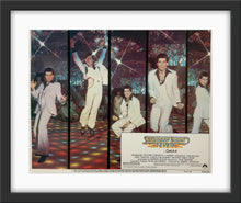 Load image into Gallery viewer, An original 11x14 lobby card for the John Travolta film Saturday Night Fever