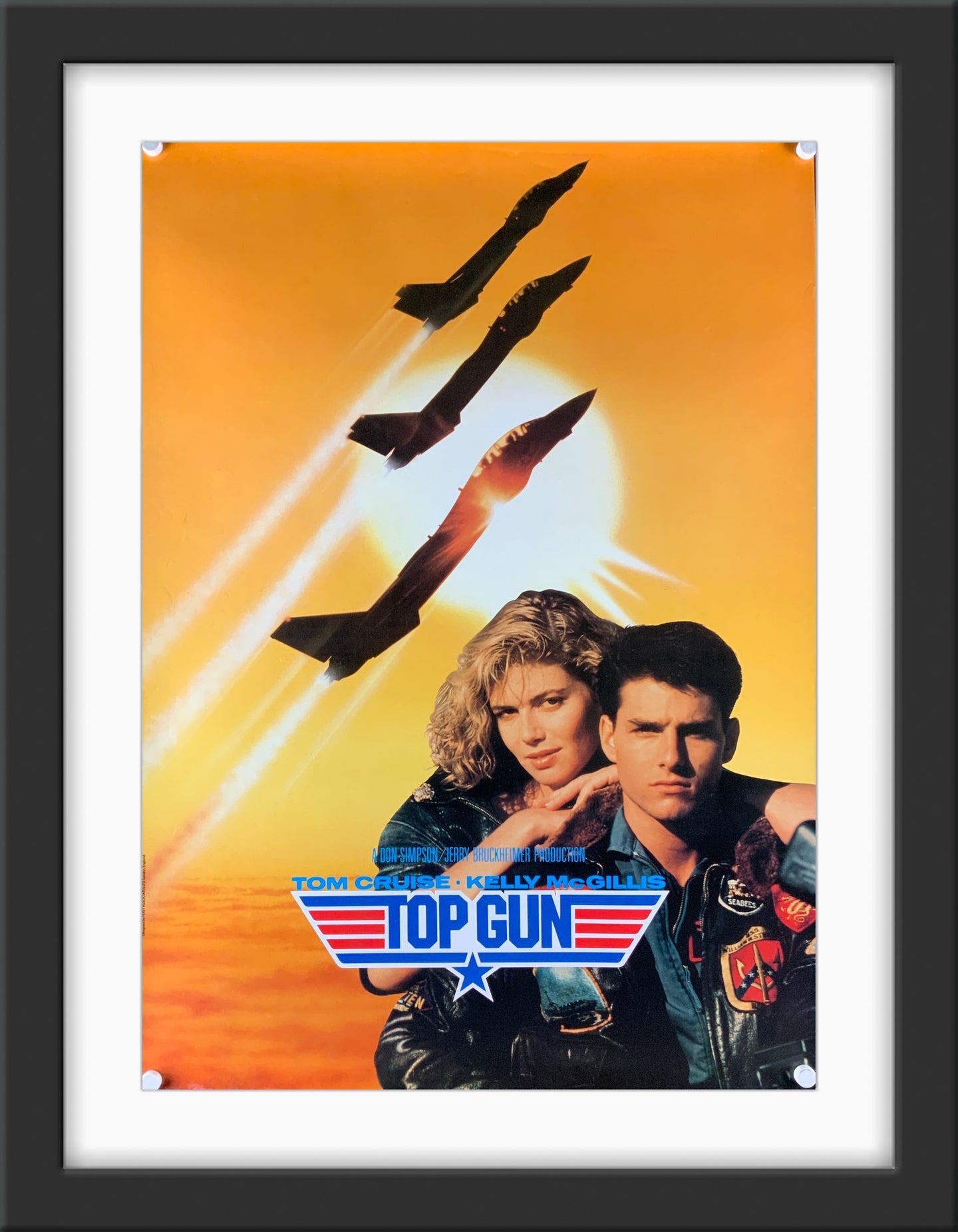 An original movie poster for the Tom Cruise film Top Gun