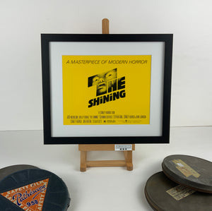 An original 8x10 title lobby card with art by Saul Bass for the Stanley Kubrick film The Shining