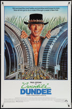 Load image into Gallery viewer, An original movie poster for the film Crocodile Dundee