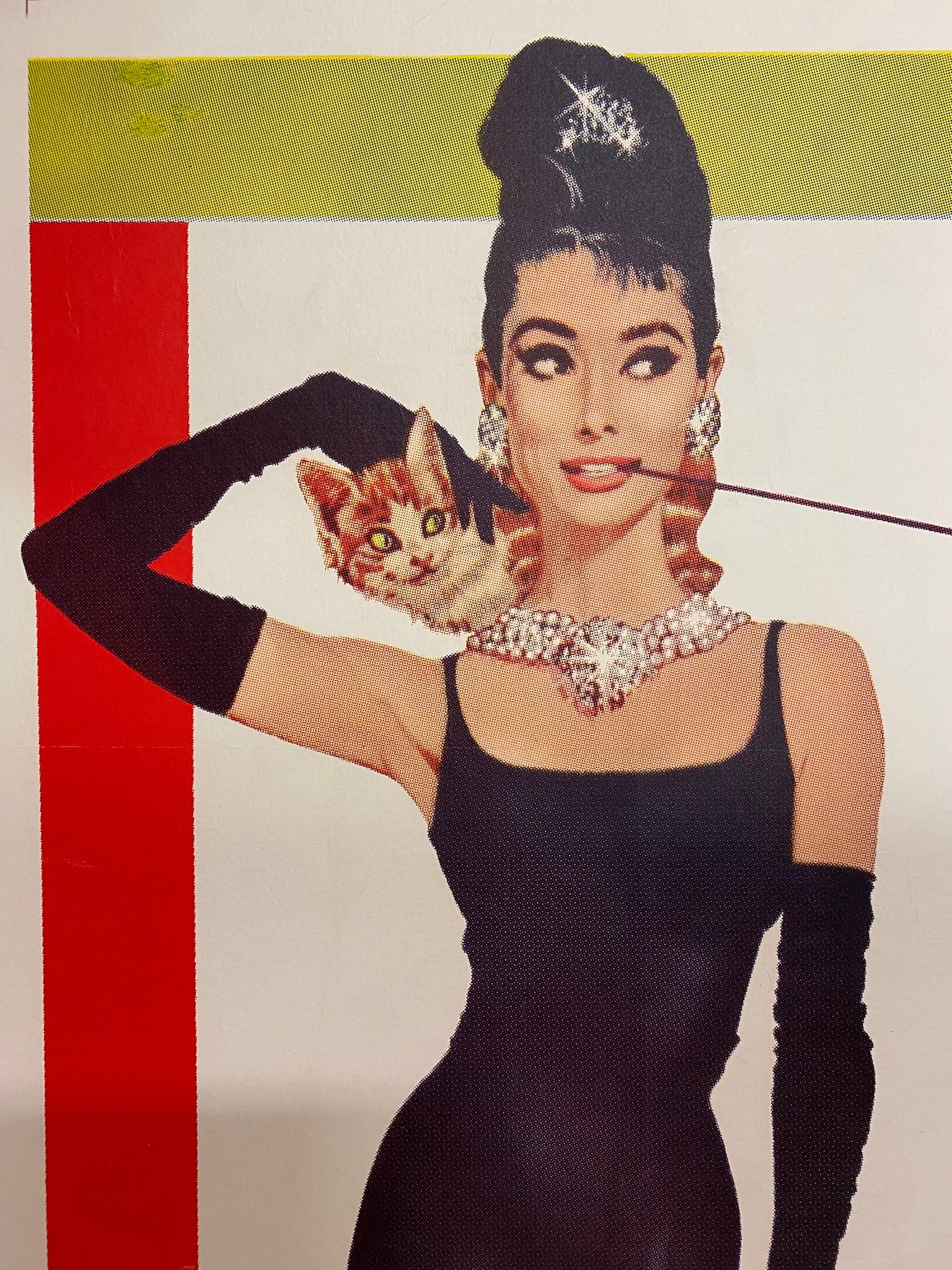 An original movie poster for the Audrey Hepburn film Breakfast At Tiffany's