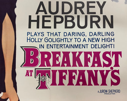 An original movie poster for the Audrey Hepburn film Breakfast At Tiffany's