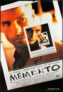 An original movie poster for the Christopher Nolan film Momento