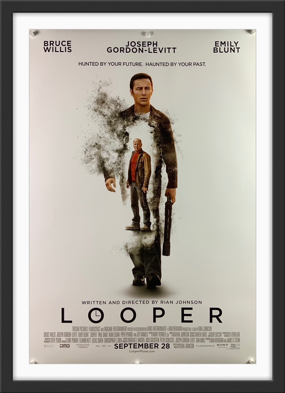 An original movie poster for the film Looper