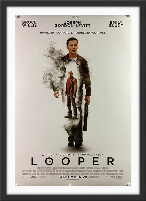 An original movie poster for the film Looper