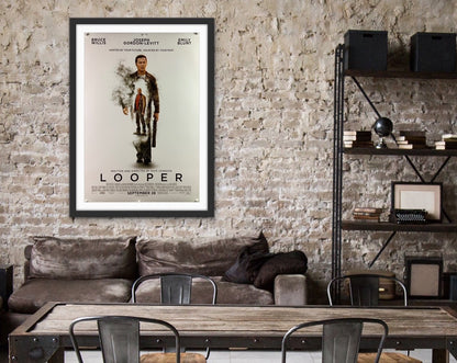 An original movie poster for the film Looper