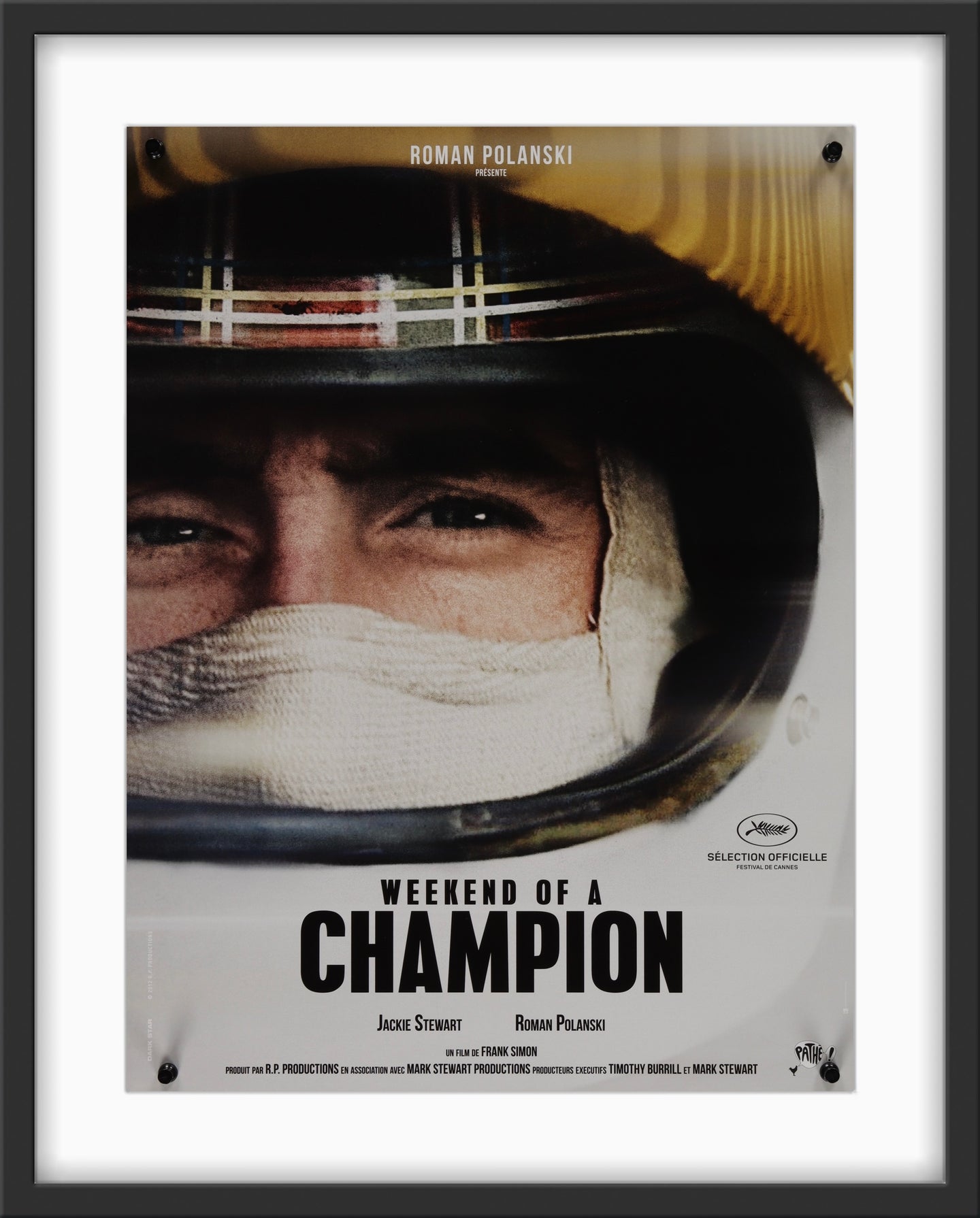 An original movie poster for the Jackie Stewart film Weekend of a Champion